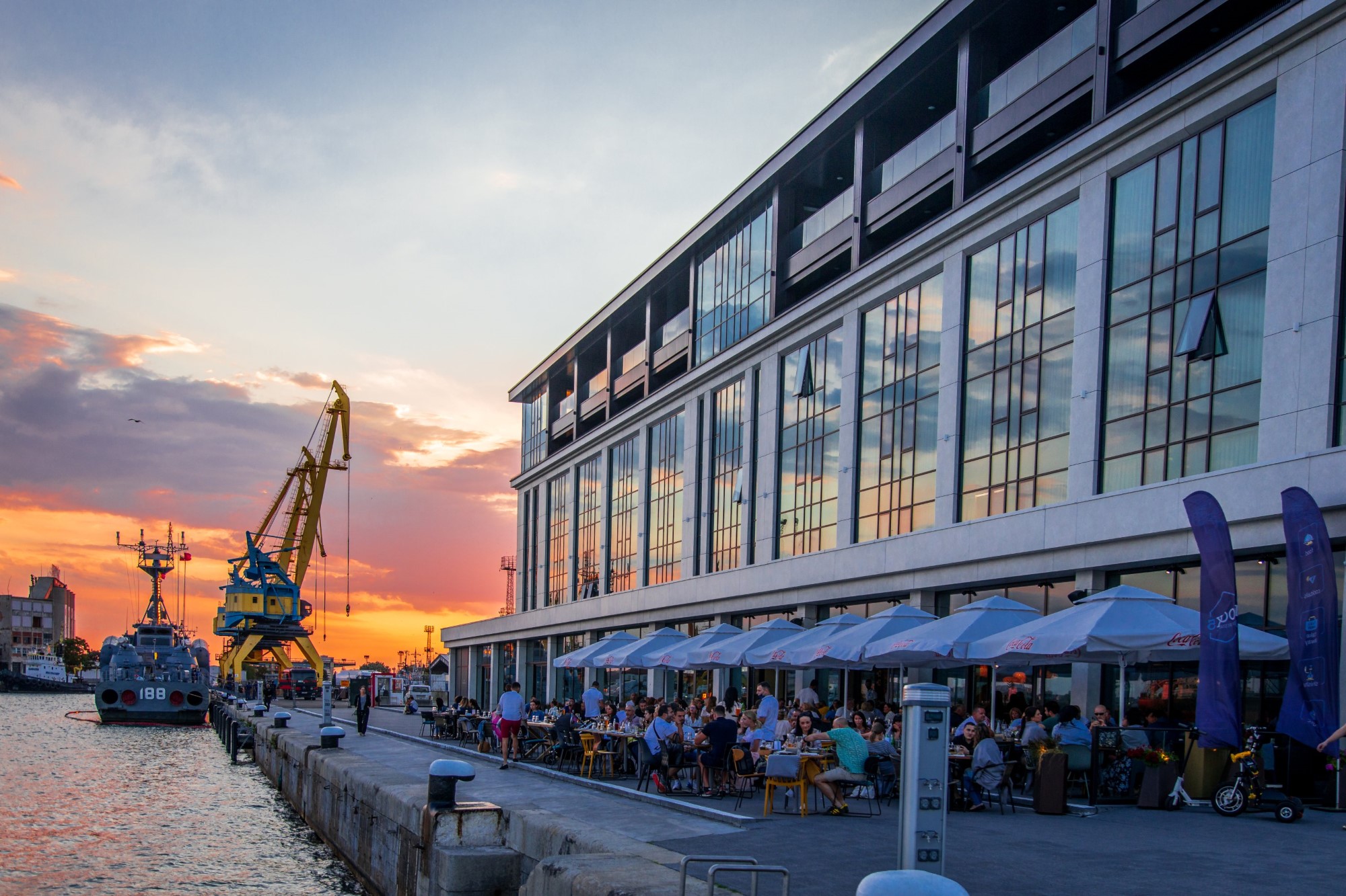 Dock 5 restaurant terrace on the Burgas port quay at sunset