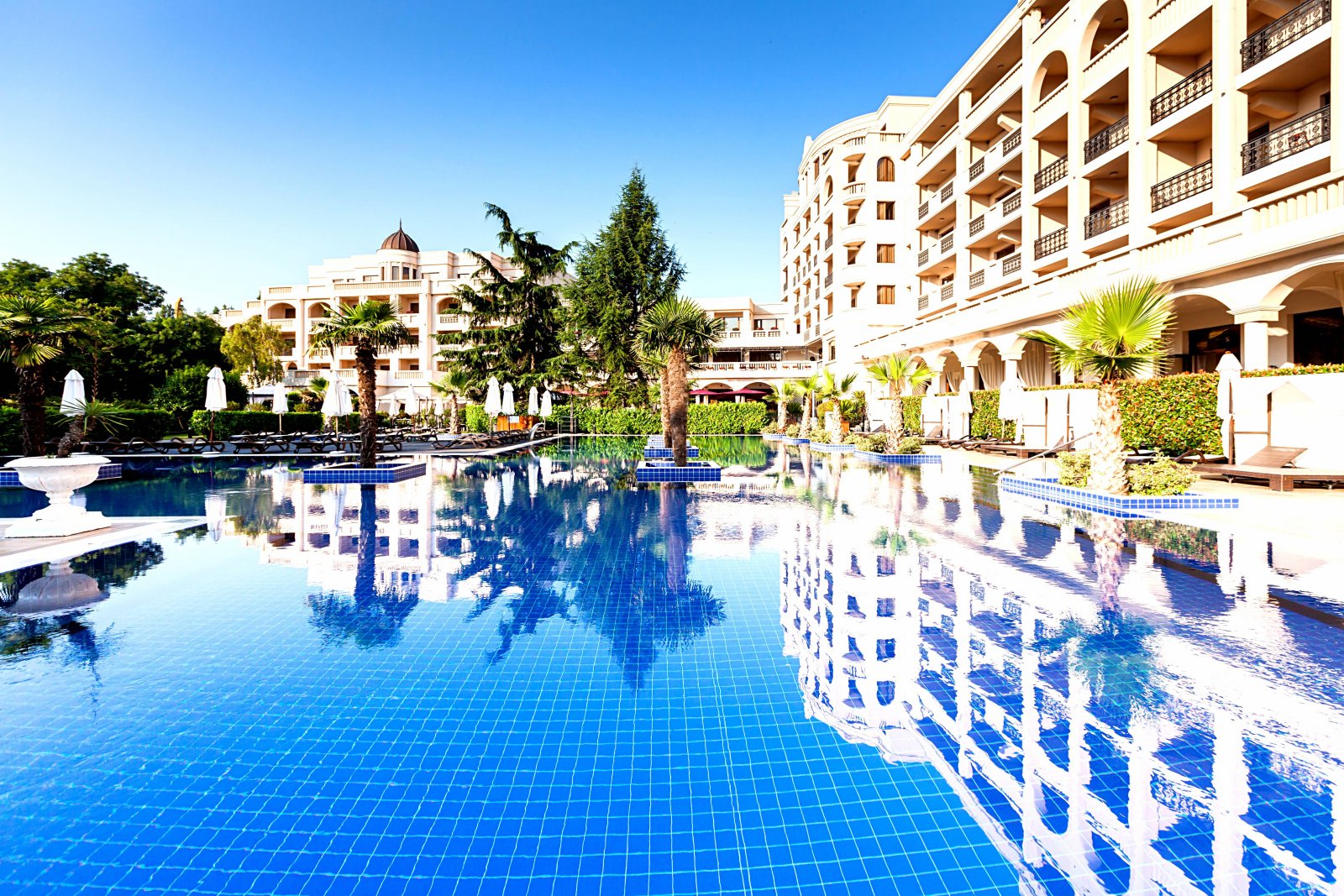 Pool and facade of Hotel Primoretz in Burgas on a sunny day
